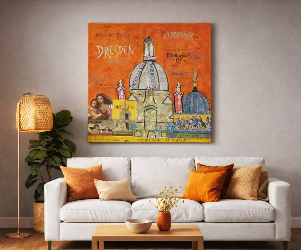 Wohnbeispiel mit Leinwanddruck Dresden in orange über hellem Sofa